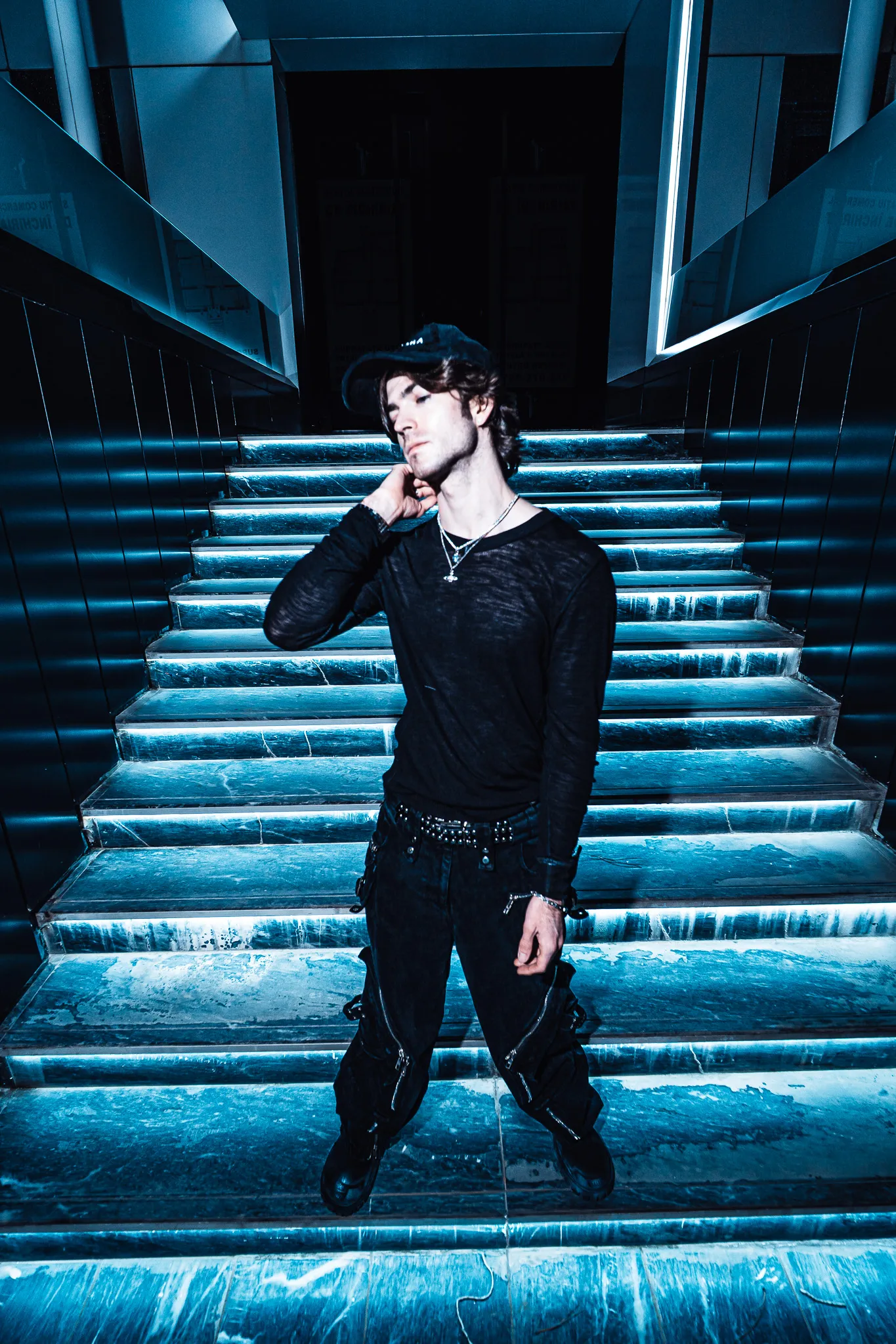 Red Dot full-length on a lit staircase