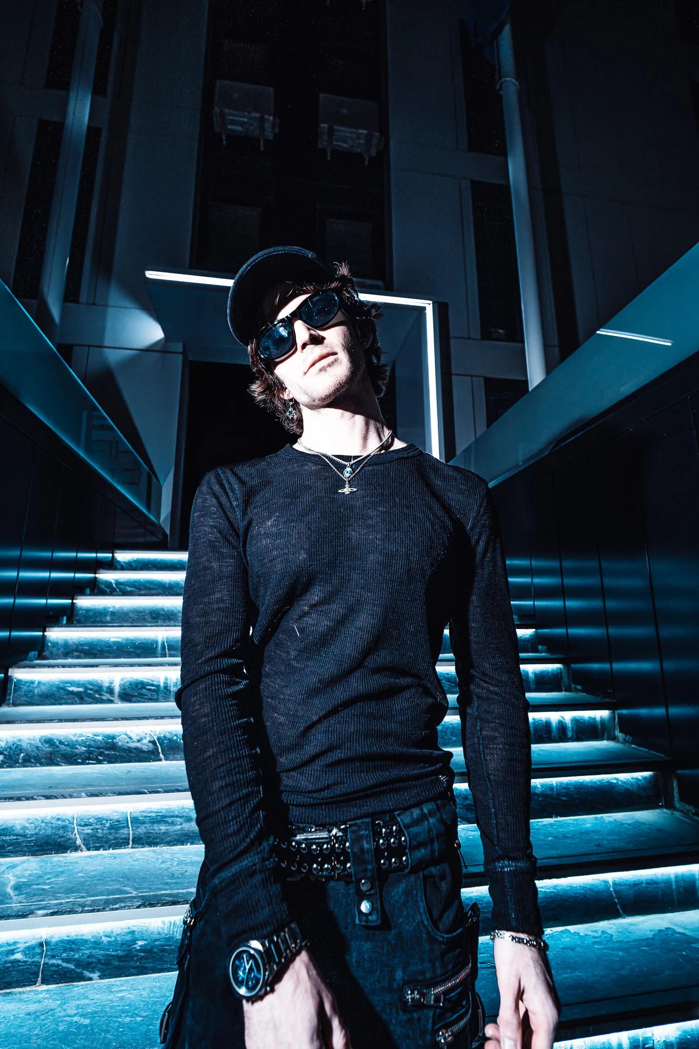 Red Dot in sunglasses and cap, close, low angle